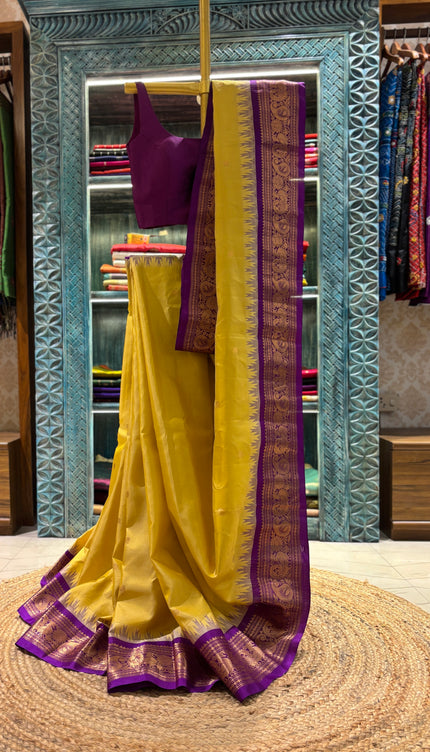 Silk _ Pure Yellow colour handwoven Gadwal Saree with purple and golden boarder