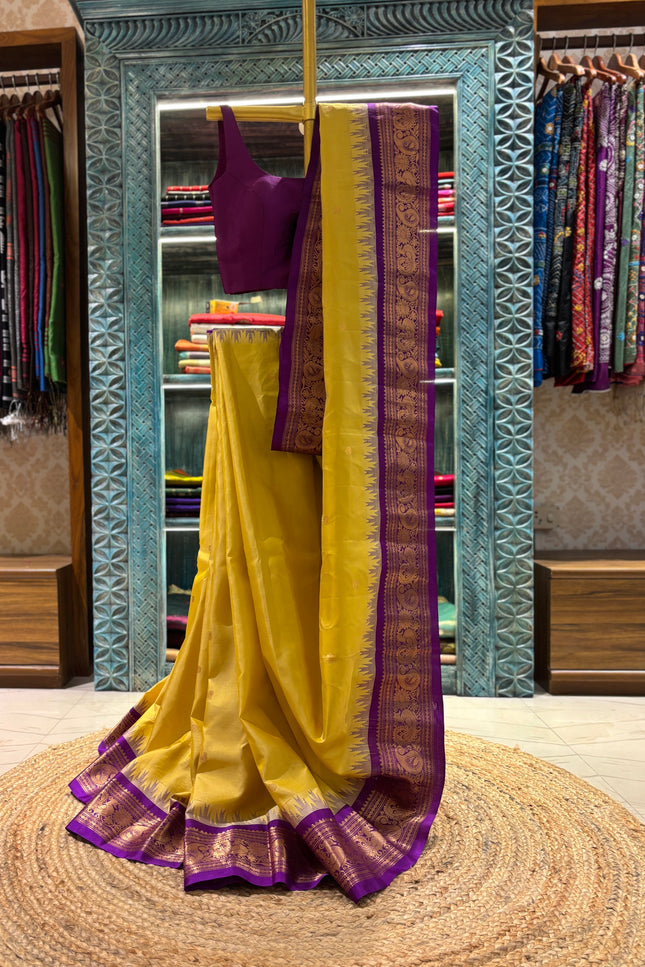 Silk _ Pure Yellow colour handwoven Gadwal Saree with purple and golden boarder
