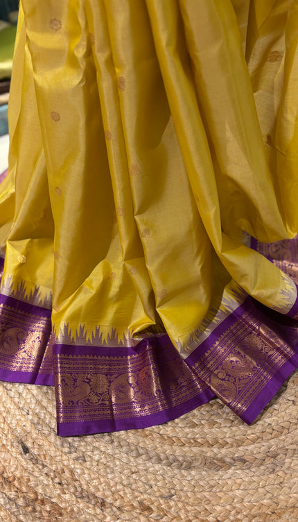 Silk _ Pure Yellow colour handwoven Gadwal Saree with purple and golden boarder