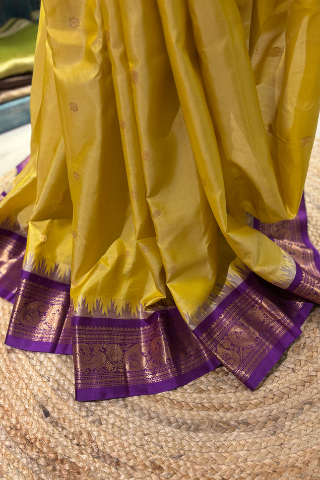 Silk _ Pure Yellow colour handwoven Gadwal Saree with purple and golden boarder
