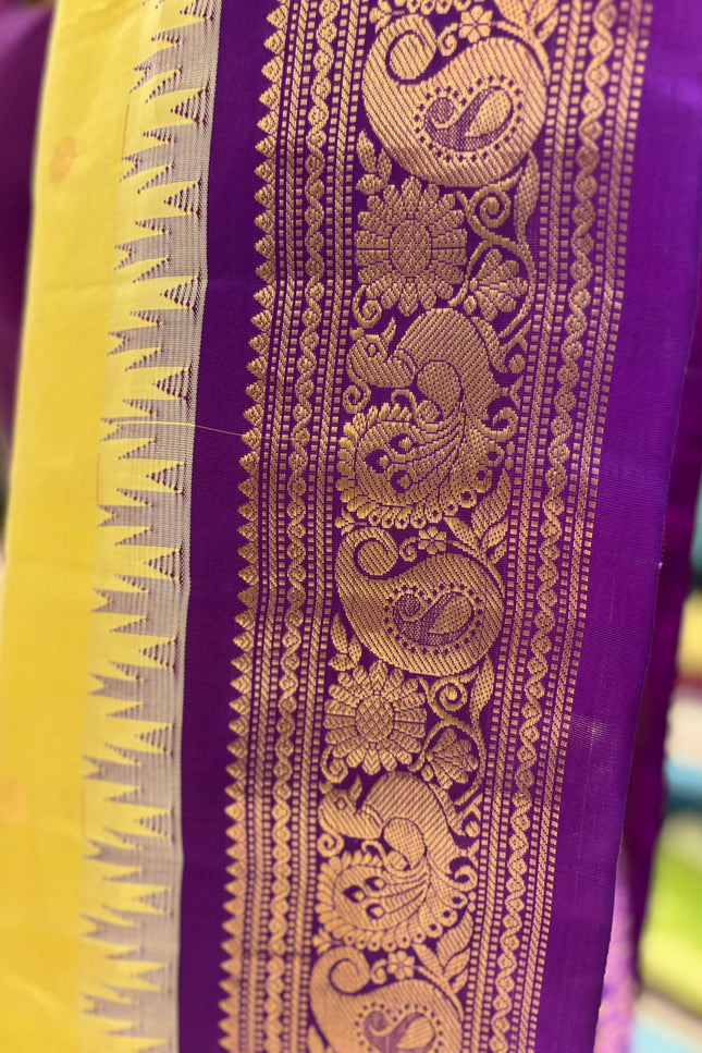 Silk _ Pure Yellow colour handwoven Gadwal Saree with purple and golden boarder