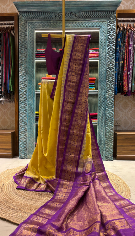 Silk _ Pure Yellow colour handwoven Gadwal Saree with purple and golden boarder