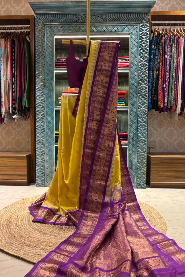 Silk _ Pure Yellow colour handwoven Gadwal Saree with purple and golden boarder